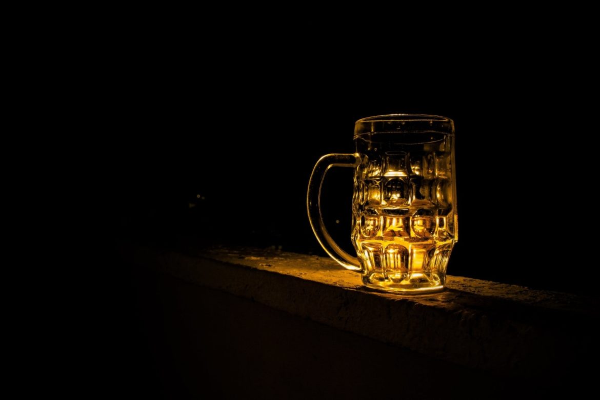 A beer mug in the dark.
