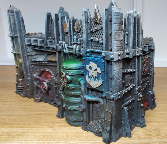 Close up of the Ork terrain with pigment powder added around the lowest corner.