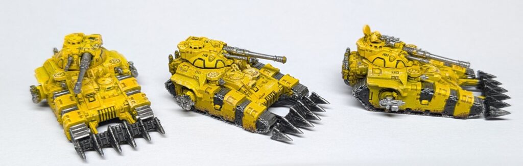 Three Kratos tanks with all base coats applied.