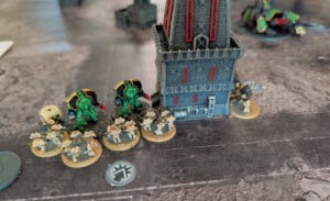 World Eater Assault Marines charge a pair of Saturnine Dreadnoughts.